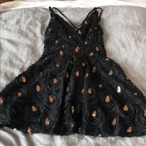 Black cocktail dress with gold sequins